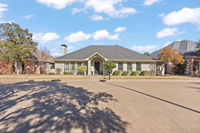 ranch-style house with a chimney