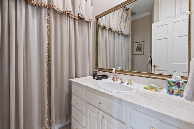 full bath featuring crown molding and vanity