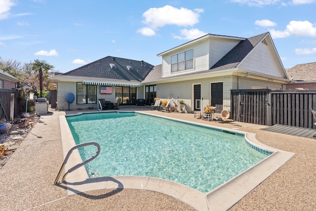 view of swimming pool with a fenced in pool, a gate, a patio area, and fence