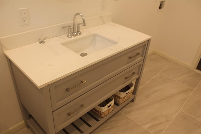 bathroom featuring vanity and baseboards