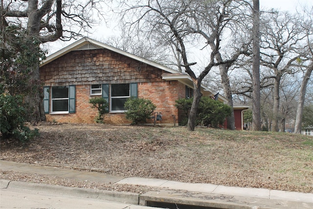 view of front of home featuring brick siding