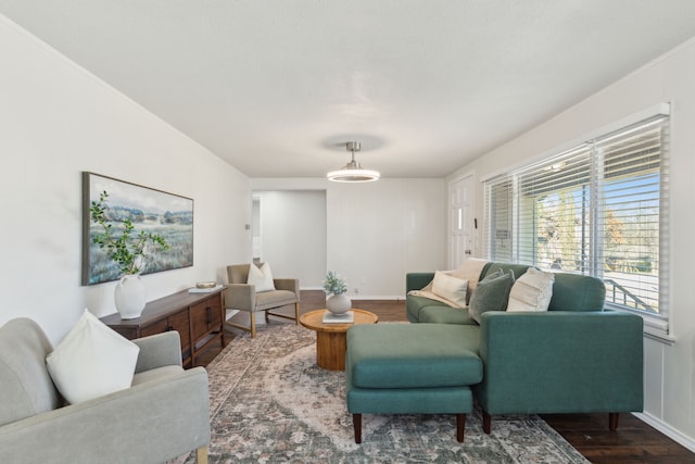 living room featuring baseboards and wood finished floors