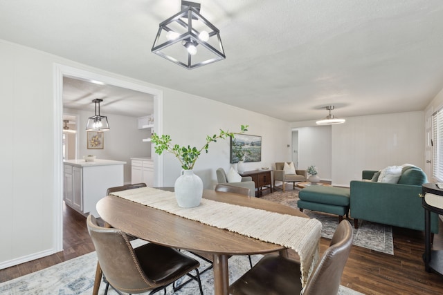 dining room with dark wood-style flooring