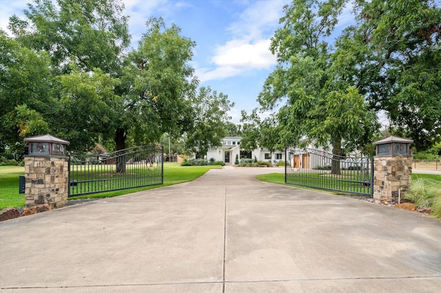 view of gate featuring a yard