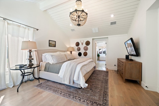 bedroom with vaulted ceiling with beams, visible vents, light wood-style flooring, a chandelier, and baseboards