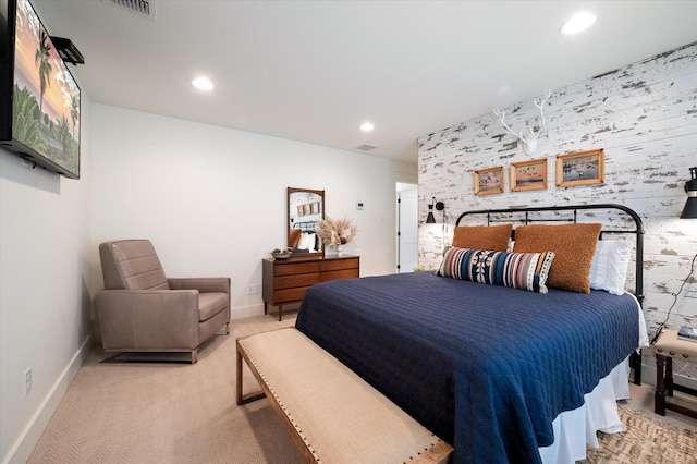 bedroom featuring light carpet, baseboards, and recessed lighting