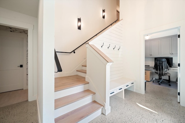 staircase with speckled floor