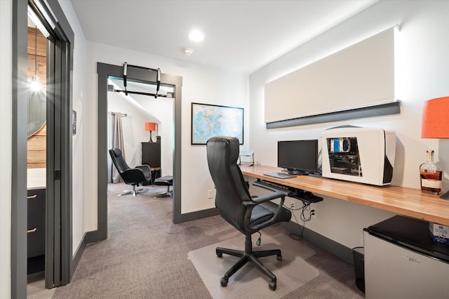 office area with light colored carpet and baseboards