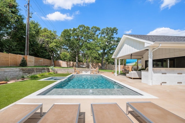 view of swimming pool with a patio area, a fenced backyard, a fenced in pool, and an in ground hot tub