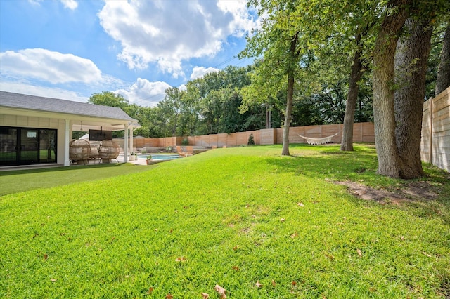 view of yard featuring a fenced backyard and a fenced in pool