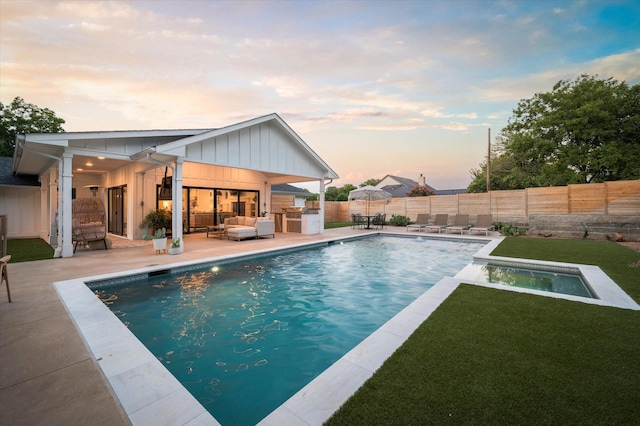 view of swimming pool featuring a fenced backyard, a patio, a fenced in pool, and area for grilling