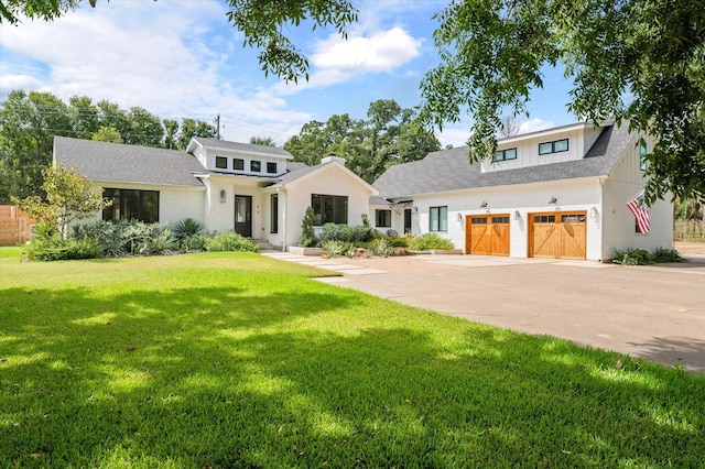 modern inspired farmhouse with driveway and a front yard