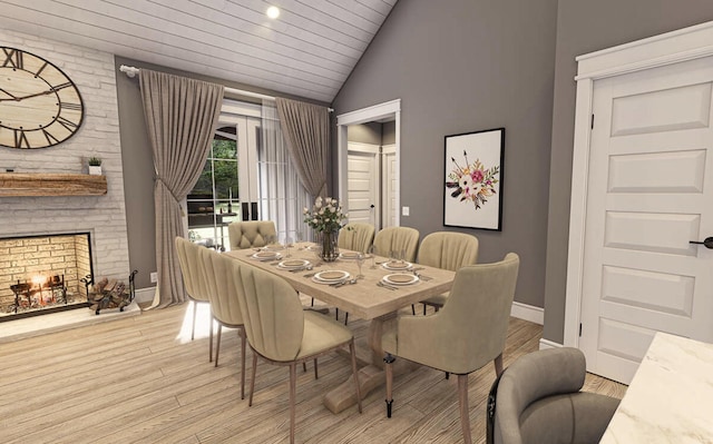 dining area with wood ceiling, light wood finished floors, baseboards, and lofted ceiling