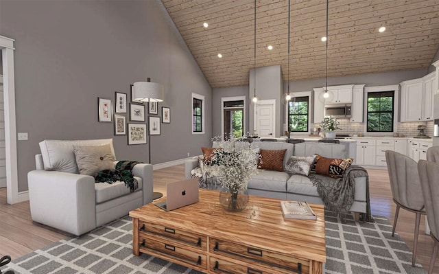 living area featuring baseboards, wood ceiling, recessed lighting, light wood finished floors, and high vaulted ceiling