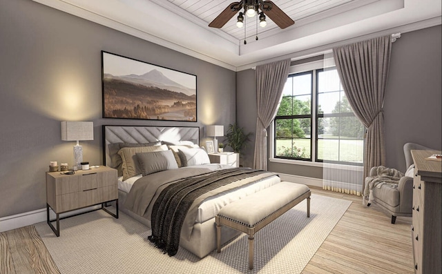 bedroom featuring light wood-type flooring, baseboards, a ceiling fan, a tray ceiling, and wooden ceiling