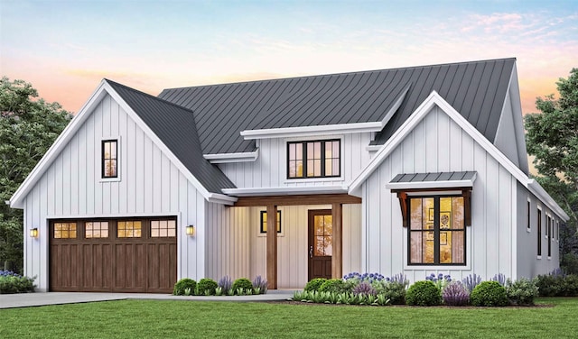 modern farmhouse style home with driveway, metal roof, board and batten siding, and a yard