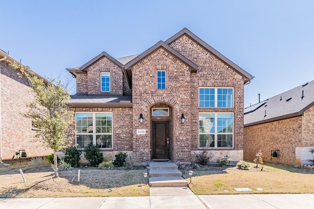 traditional-style house with brick siding