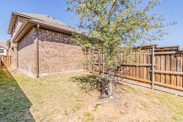 view of yard with a fenced backyard