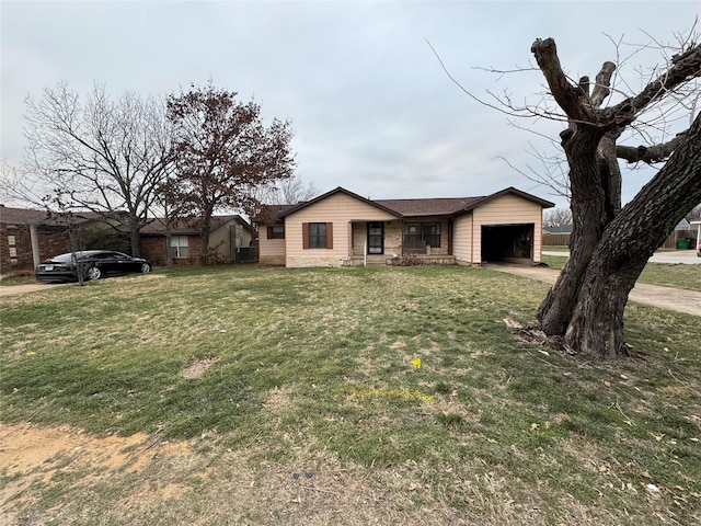 ranch-style home with an attached garage, a front lawn, and concrete driveway