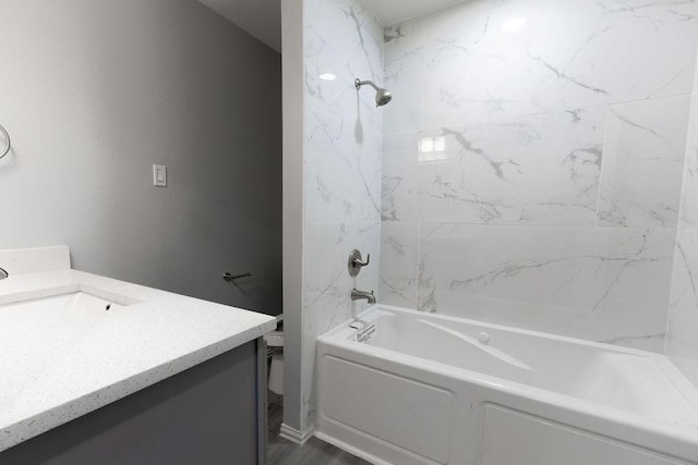3321 Old Hickory Trl, Forest Hill, TX 76140 - bathroom featuring washtub / shower combination, vanity, and toilet