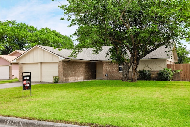 3321 Old Hickory Trl, Forest Hill, TX 76140 - view of front facade with a garage, brick siding, asphalt driveway, and a shingled roof