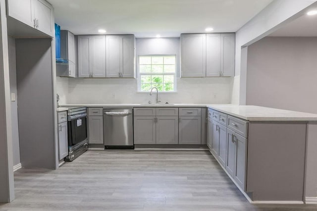 3321 Old Hickory Trl, Forest Hill, TX 76140 - kitchen featuring dishwasher, a sink, electric range, a peninsula, and gray cabinets