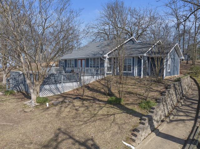 ranch-style home with a wooden deck