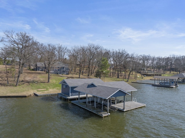 dock area with a water view and boat lift