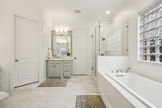 bathroom featuring a garden tub, a shower stall, vanity, and crown molding