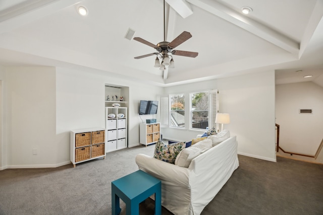 carpeted living room with a tray ceiling, vaulted ceiling with beams, visible vents, ceiling fan, and baseboards