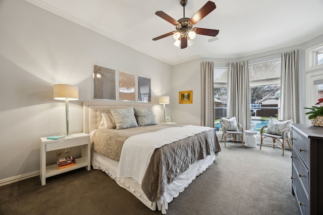 bedroom featuring ornamental molding, dark carpet, baseboards, and a ceiling fan