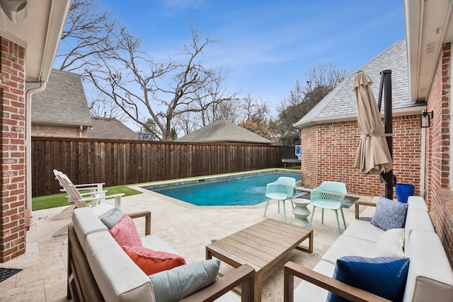 view of swimming pool with a fenced in pool, a fenced backyard, a patio, and an outdoor hangout area