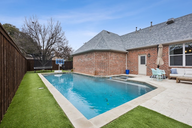 view of pool with a patio, a lawn, a fenced backyard, and a fenced in pool