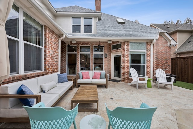 view of patio featuring fence and an outdoor hangout area