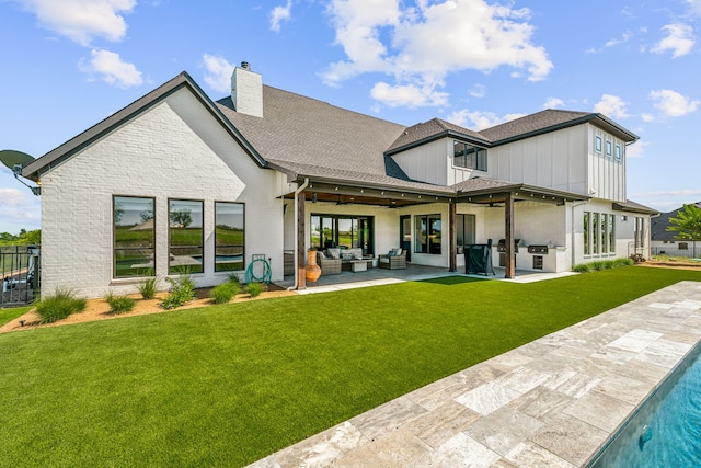 back of property featuring brick siding, an outdoor hangout area, board and batten siding, a patio area, and ceiling fan