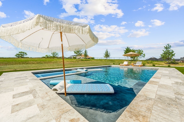 outdoor pool featuring a patio area, fence, and a lawn