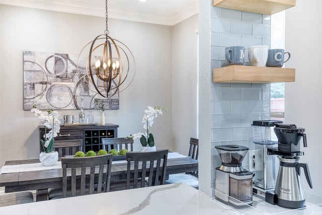 dining area with ornamental molding and a chandelier