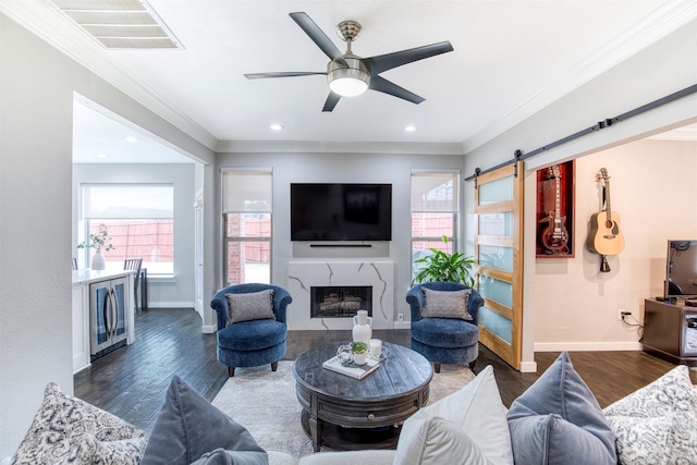 living area featuring crown molding, visible vents, dark wood finished floors, and baseboards