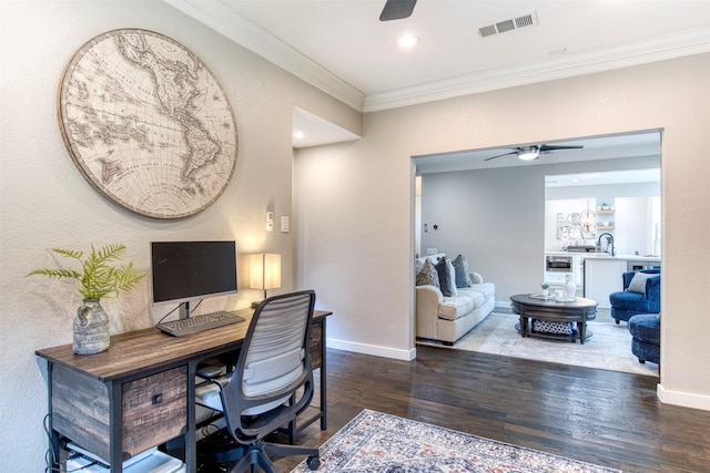 office space with ceiling fan, baseboards, visible vents, and crown molding