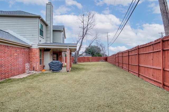 view of yard featuring a fenced backyard