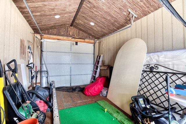 garage with wooden ceiling and wooden walls