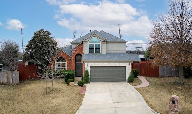 traditional home with a garage, driveway, brick siding, and fence