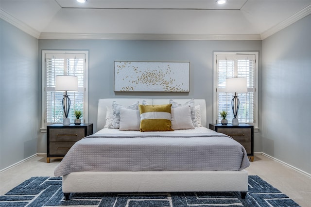 carpeted bedroom with baseboards, a raised ceiling, and crown molding