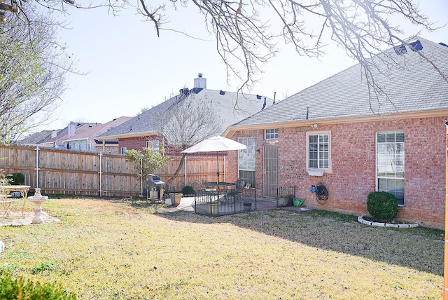 view of yard with a patio area and fence