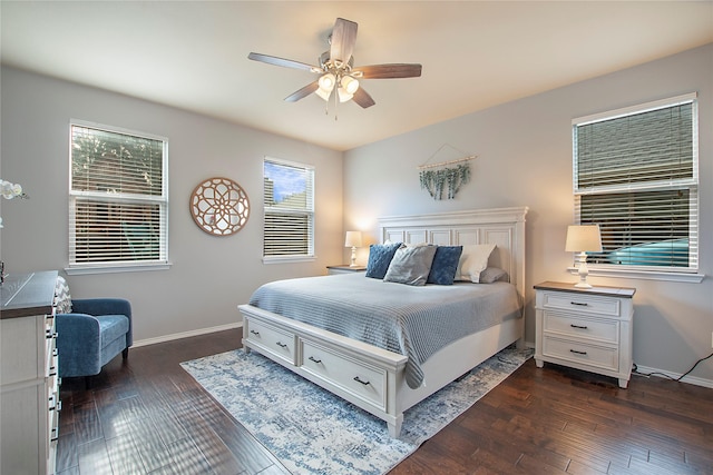 bedroom featuring ceiling fan, baseboards, and dark wood-type flooring