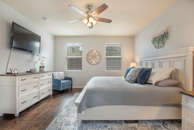 bedroom featuring ceiling fan, dark wood finished floors, and baseboards
