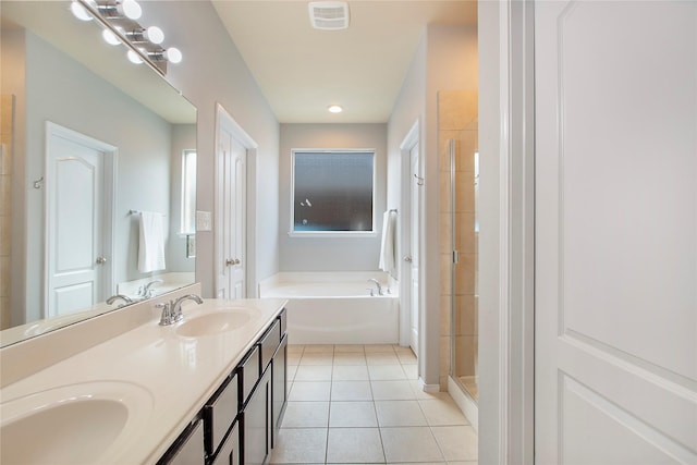 full bath featuring tile patterned flooring, a sink, visible vents, double vanity, and a stall shower