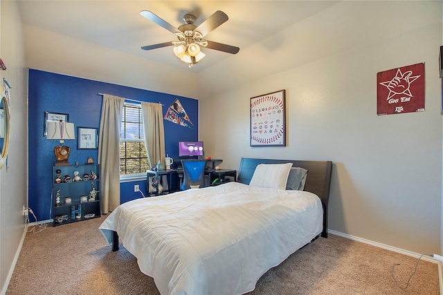 carpeted bedroom with ceiling fan and baseboards