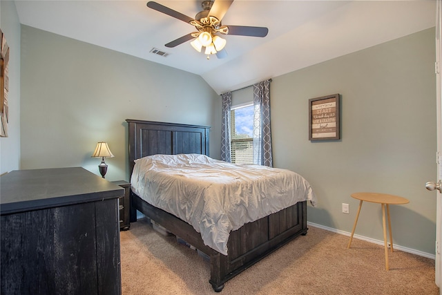 bedroom with lofted ceiling, light colored carpet, visible vents, a ceiling fan, and baseboards
