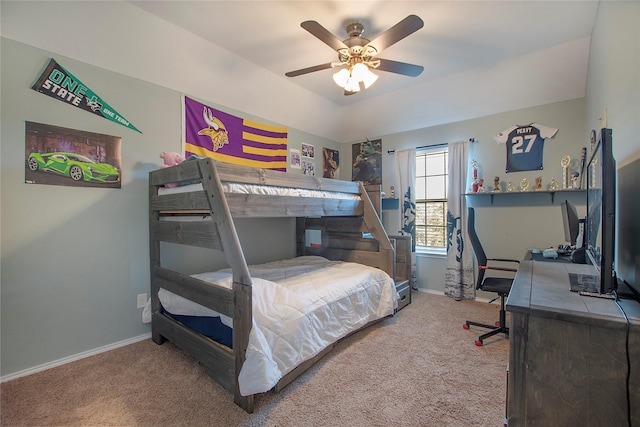 carpeted bedroom with baseboards and a ceiling fan